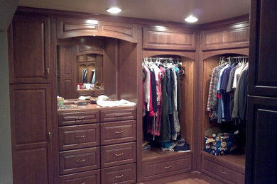 Example of a classic closet design in Other
