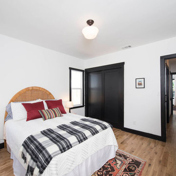 Red pillows, plaid throw, wicker