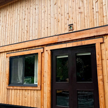 Aging cedar (wood) siding with brand-new cedar plank