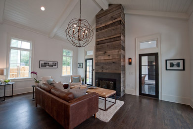 Design ideas for a modern living room in Atlanta with a standard fireplace and a wood fireplace surround.