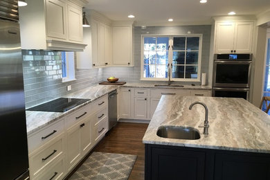 Transitional u-shaped kitchen photo in DC Metro with beaded inset cabinets, white cabinets, stainless steel appliances and an island