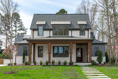 Example of a transitional exterior home design in Raleigh