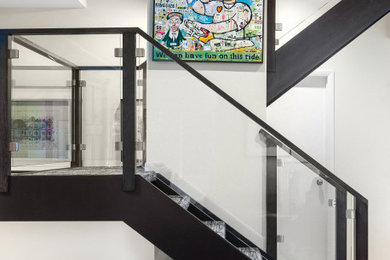 Inspiration for a mid-sized contemporary u-shaped glass railing staircase remodel in Chicago