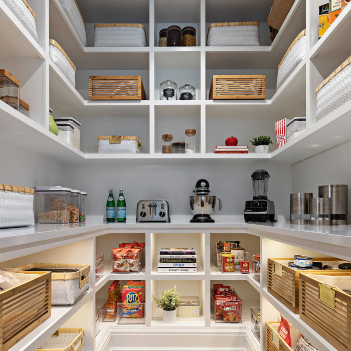 Today's pantries are functional and gorgeous! Our custom pantry creates ample space for every day appliances to be kept out of sight, with easy access to bins and storage containers. Undercounter LED