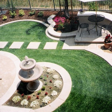 Birds eye view of stepping stones in lawn with raised entertaining area
