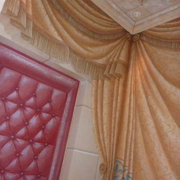 Trompe l'oeil curtaining, tenting, stone work and leather studded door