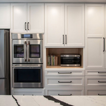 Kitchen with White Perimeter and Blue Island Cabinet Reface