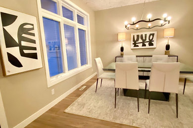 Large trendy vinyl floor, beige floor, wallpaper ceiling and wallpaper kitchen/dining room combo photo in Other with beige walls