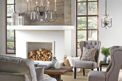 Inspiration for an enclosed medium tone wood floor living room remodel in Other with gray walls, a standard fireplace and a plaster fireplace