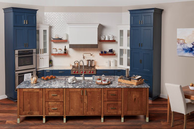 Example of a transitional u-shaped eat-in kitchen design in Birmingham with an island