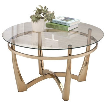 Bowery Hill Round Glass Top Coffee Table in Champagne
