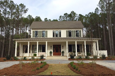 Large country two-storey white house exterior in Atlanta with wood siding, a gable roof and a shingle roof.