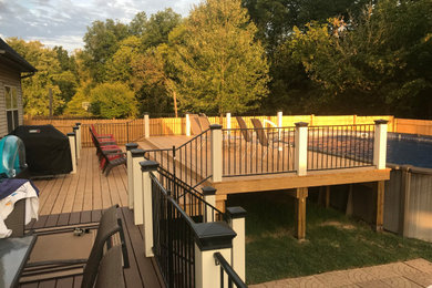 Customized deck addition around an existing pool.