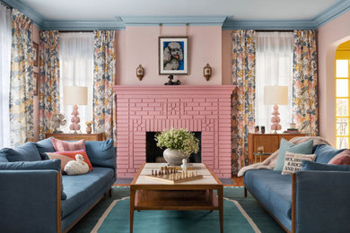 Eclectic living room photo in Atlanta with a brick fireplace