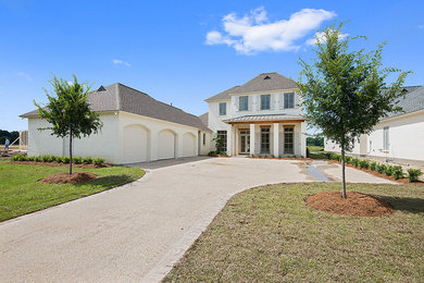 Inspiration for a large transitional exterior home remodel in New Orleans