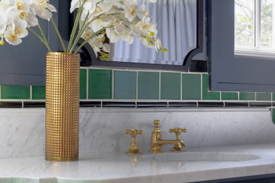 Freestanding bathtub - green tile marble floor, single-sink and wainscoting freestanding bathtub idea in Austin with blue cabinets, blue walls, an undermount sink, marble countertops, white countertops and a freestanding vanity