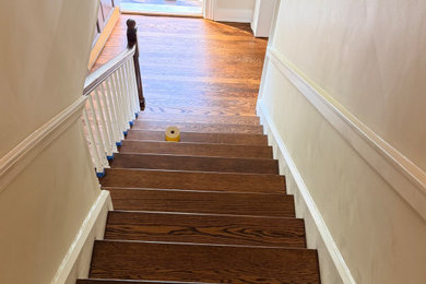 Staircase - mid-sized contemporary wooden straight staircase idea in New York with wooden risers