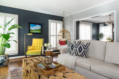 Photo of an eclectic enclosed living room in Dallas with grey walls, dark hardwood floors and brown floor.