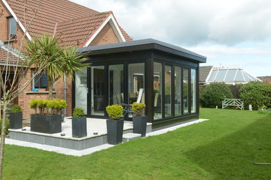 Inspiration for a medium sized contemporary conservatory in Other with ceramic flooring, a standard ceiling and grey floors.