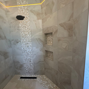 Curd-less walk-in shower; heated floors in bathroom + shower+bench LED