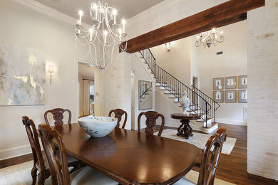 Inspiration for a large transitional dark wood floor kitchen/dining room combo remodel in New Orleans with a standard fireplace and a stone fireplace
