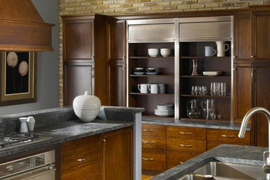 Example of a large transitional galley light wood floor eat-in kitchen design in New York with a double-bowl sink, flat-panel cabinets, dark wood cabinets, wood countertops, beige backsplash, stone tile backsplash, stainless steel appliances and no island