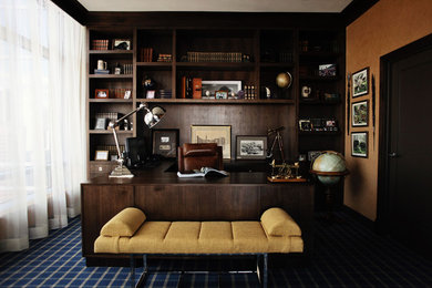 Example of a large minimalist built-in desk carpeted study room design in Los Angeles with beige walls