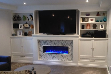 Photo of a contemporary family room in Vancouver with a tile fireplace surround.