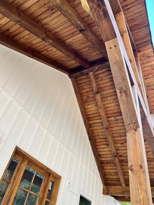 What should I hang from the wooden rafters on my front porch?