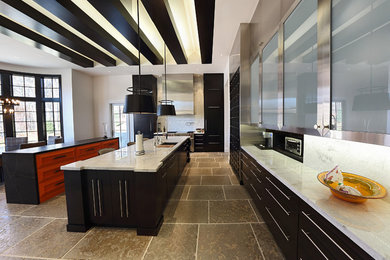 Expansive contemporary u-shaped eat-in kitchen in Baltimore with an undermount sink, flat-panel cabinets, black cabinets, granite benchtops, white splashback, stone slab splashback, stainless steel appliances, ceramic floors and with island.