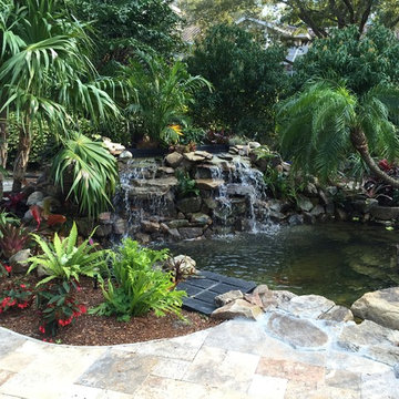 New Screen Enclosure with Pool Remodel with Koi Pond