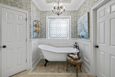 Example of a mid-sized classic master ceramic tile, brown floor, double-sink, tray ceiling and wallpaper bathroom design in Atlanta with raised-panel cabinets, blue cabinets, a two-piece toilet, an undermount sink, quartz countertops, a hinged shower door, white countertops and a built-in vanity