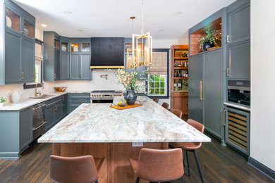 Eat-in kitchen - mid-sized transitional u-shaped dark wood floor and brown floor eat-in kitchen idea in Charlotte with blue cabinets, granite countertops, white backsplash, ceramic backsplash, paneled appliances, an island, multicolored countertops, an undermount sink and recessed-panel cabinets
