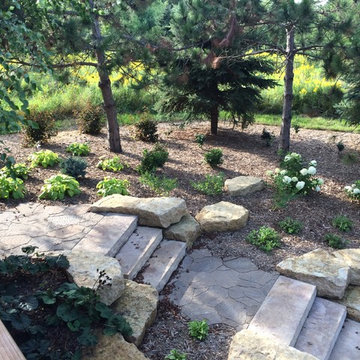 Step units, boulder outcroppings and a natural sidewalk