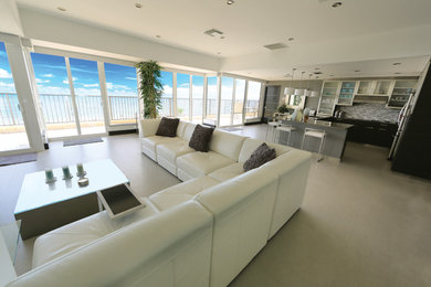 Inspiration for a modern open concept porcelain tile living room remodel in Miami