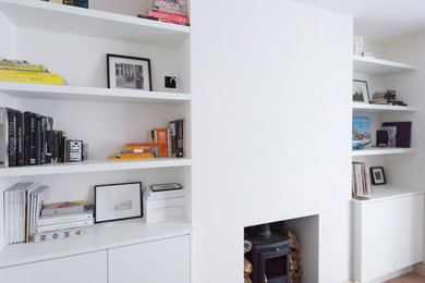 This is an example of a medium sized contemporary formal enclosed living room in London with no tv.