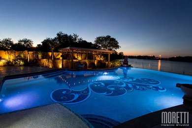 Inspiration for a mid-sized coastal backyard custom-shaped and stone aboveground pool house remodel in Austin