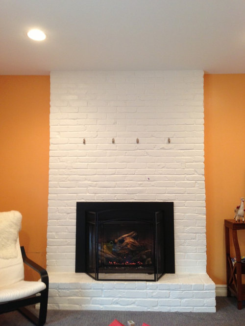 How large should art be over this fireplace?