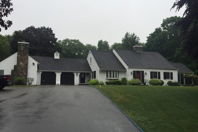 Example of a huge classic white two-story concrete fiberboard exterior home design in Boston