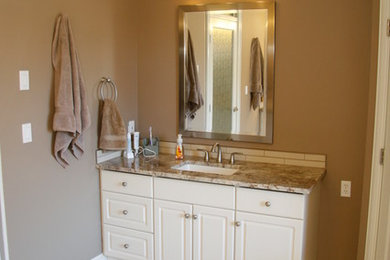 Inspiration for a large contemporary master beige tile and porcelain tile porcelain tile bathroom remodel in Vancouver with shaker cabinets, white cabinets, a two-piece toilet, brown walls, an undermount sink and marble countertops