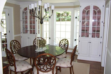 Inspiration for a large dark wood floor enclosed dining room remodel in Baltimore with beige walls