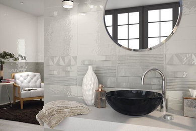 Inspiration for a mid-sized modern 3/4 gray tile and ceramic tile light wood floor and brown floor bathroom remodel in Austin with open cabinets, gray cabinets, gray walls, a vessel sink and solid surface countertops