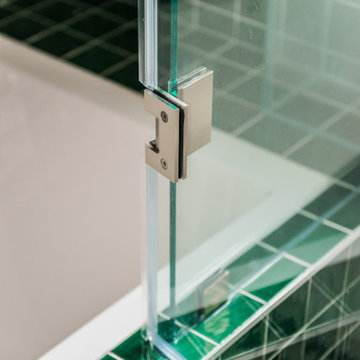 Vibrant Green Ceramic Tiles Bring Life to a Hallway Bathroom