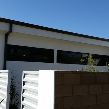 Costa Mesa, New Modern Home. Angle Face 5 inch Gutters, Smooth Downspouts.