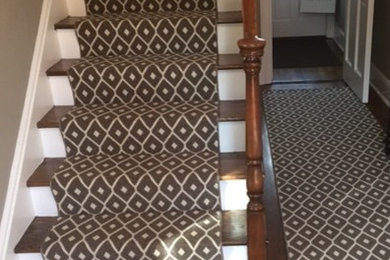 Mid-sized transitional wooden straight wood railing staircase photo in New York with wooden risers