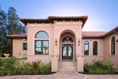 Example of a tuscan exterior home design in Tampa