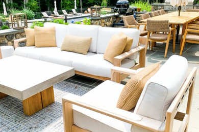 Large elegant backyard deck photo in New York with a fireplace