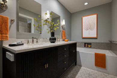 Example of a trendy 3/4 gray tile white floor and double-sink alcove bathtub design in San Francisco with black cabinets, gray walls, an undermount sink, white countertops and a freestanding vanity