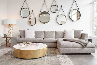 Example of a large danish open concept concrete floor and gray floor living room design in Cincinnati with white walls, no fireplace and no tv