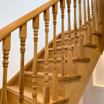 Traditional oak staircase with continous handrail